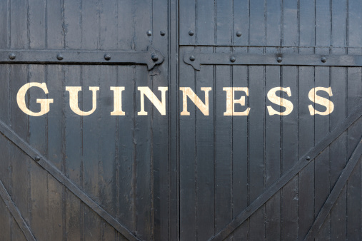 Dublin, Ireland - May 12, 2012: Closed gate outside the St. James's Gate Brewery in Dublin, Ireland.  St. James's Gate is the home of Guinness beer.