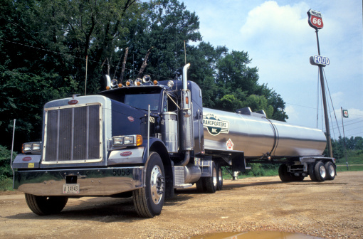 Tulsa, United States - July 30, 2003: Peterbilt tanker lorry in parking lot on the interstate 66 near Tulsa Oklahoma. The truck pulls a Miller Transporters Inc. tanker. Miller Transporters Inc. is a Jackson based bulk tank truck operator.