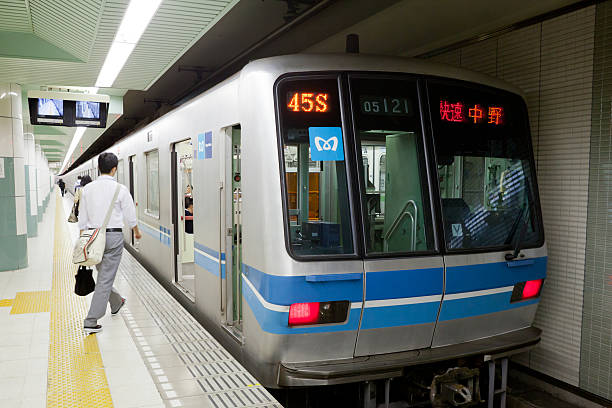 Yachiyo City, Japan - September 28, 2011 : Passengers at the Toyo-Katsutadai Station, Yachiyo City, Japan. The Tokyo Metro train parked at the Toyo-Katsutadai Station. This station is providing an extension service of Tokyo Metro Tozai Line.