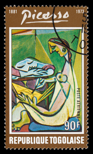 Sacramento, California, USA - January 11, 2011: A 1974 Togo postage stamp containing a portion of The Muse, painted by Pablo Picasso in 1935.