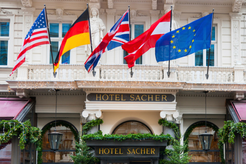 Vienna, Austria - December 4, 2011: Famous Hotel Sacher Entrance in Downtown Vienna, Austria with several Flags, decorated during Christmas Time.