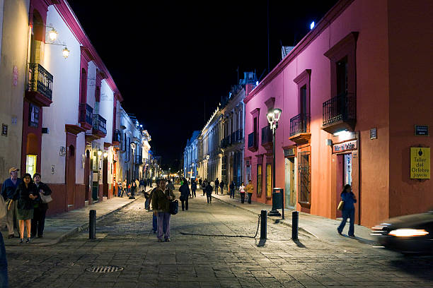 Oaxaca, Mexico - November 10, 2011: View of locals and turists along the pedestrian street that goes from the Oaxaca main square or Plaza de Armas, to the Santo Domingo Church.