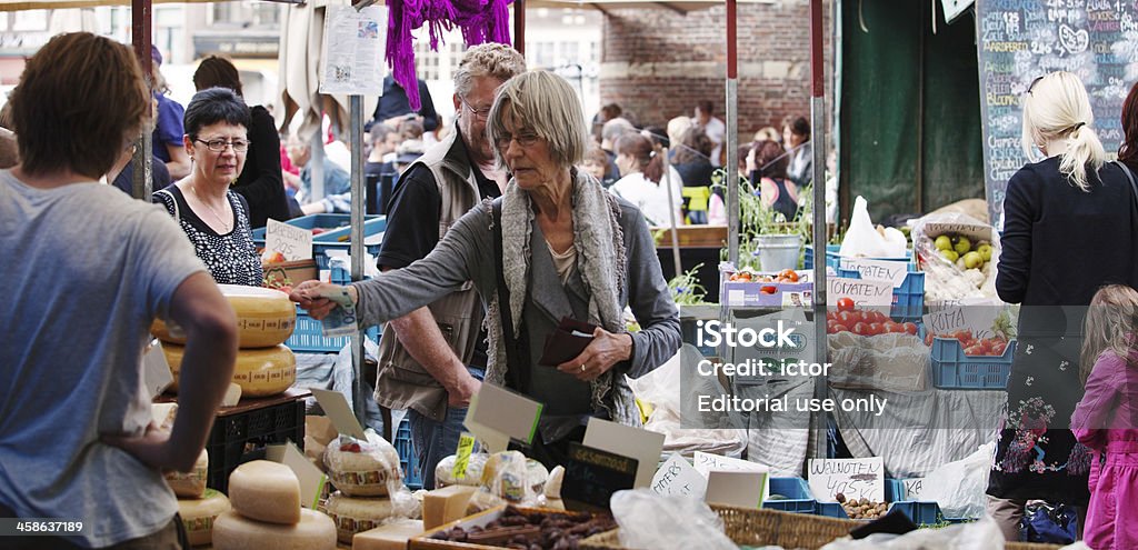 Street market in Amsterdam Amsterdam, the Netherlands -May 21, 2011: Organic saturday street market on Nieuwmarkt.  Nieuwmarkt is a square in the centre of the Dutch capital Amsterdam. Every saturday there is a street market where they sell food of organic origin. Adult Stock Photo