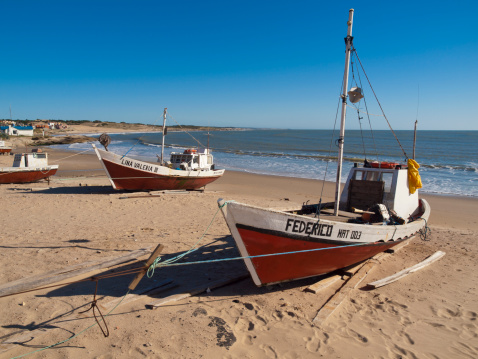 Punta del Diablo, Uruguay - November 8, 2009: Small fishing boats on the beach at Punto del Diablo in Uruguay