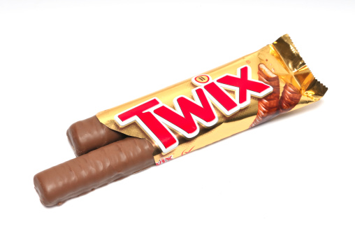 Kampen, The Netherlands - June 30, 2011: Twix candy bar isolated on a white background. Twix is a candy bar made by Mars, Inc., consisting of a biscuit finger, topped with caramel and coated in milk chocolate
