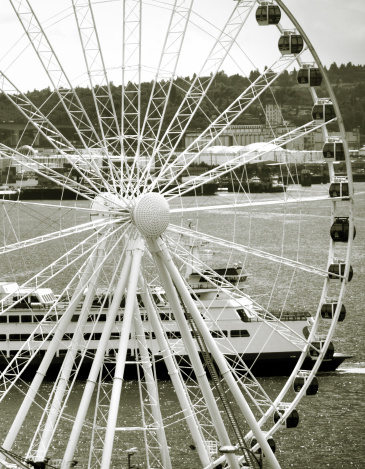 Black and White photo of Navy Pier and it's ferris wheel as seen from a boat on Lake Michigan