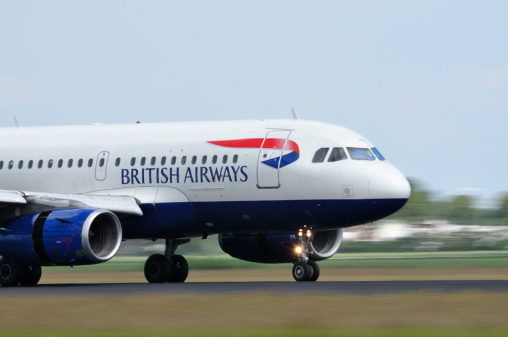 Schiphol, The Netherlands - June 12, 2011: British Airways Airbus A320 taking off from Schiphol airport.