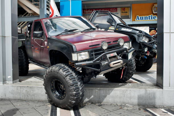 Big off-road vehicle monster truck car stands on the road in the city