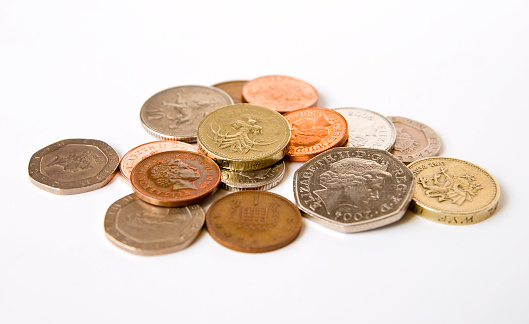 London, England - July 18, 2007: An assortment of British coins, including &pound;1 (one pound), 50p (fifty pence) 20p (twenty pence), 10p (ten pence), 5p (five pence), 2p (two pence) and 1p (one penny). Some show the front, some the back. Decimal coinage in Great Britain dates from 15th February 1971, replacing the old 'pound, shillings and pence' system.