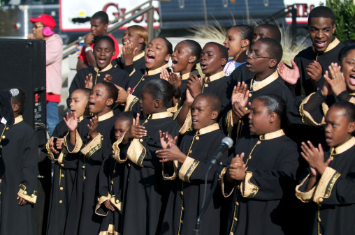 Little Rock, Arkansas, USA, October 22, 2011: Youthful gospel choir, The Pastor's Choir, performs at the Susan G. Komen Race for the Cure, a fundraiser for the research and treatment of breast cancer.