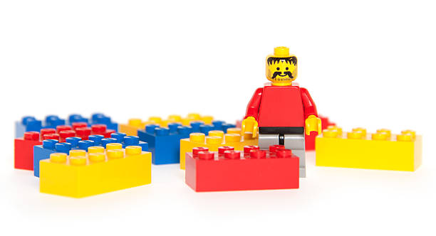 Albuquerque, USA - December 11, 2011: Studio shot. Lego, consists of colorful interlocking plastic bricks and an accompanying array of gears, minifigures and various other parts. Lego bricks can be assembled and connected in many ways, to construct such objects as vehicles, buildings, and even working robots. Anything constructed can then be taken apart again, and the pieces used to make other objects. The toys were originally designed in the 1940s in Denmark and have achieved an international appeal.