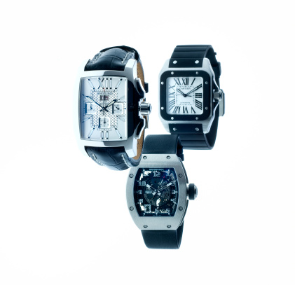 Leiden, The Netherlands - June 26, 2008: Product shot of a Breitling Bentley chronograph, Cartier Santos 100 and Richard Mille RM 010 wristwatch shot in studio on white background.