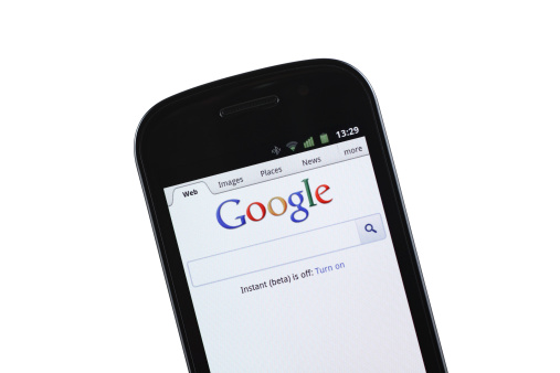 Izmir, Turkey - September 14, 2011: Google mobile site is opened on the Google Nexus S smart phone. Google is the largest search engine on the web. Google Nexus S is a mobile phone which is provided by Google and produced by Samsung.