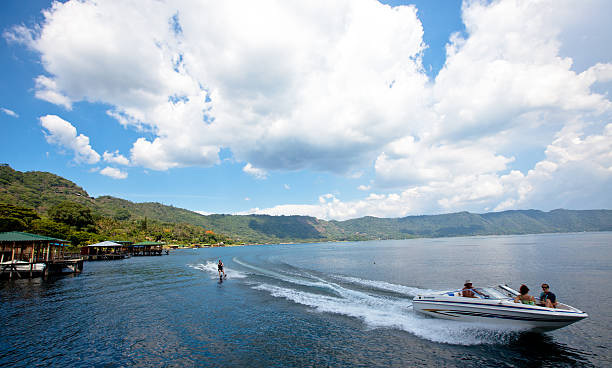 Water skiing on Lago de Coatepeque (Crater lake) El Salvador stock photo