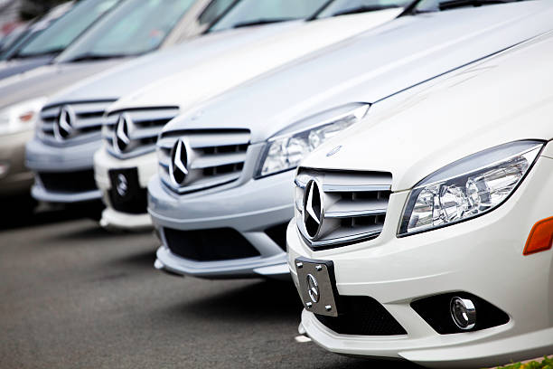 Halifax, Nova Scotia, Canada - August 7, 2011: Various Mercedes Benz vehicles in a row at a Mercedes dealership. Focus on first automobile, with all vehicles being from a similar class.