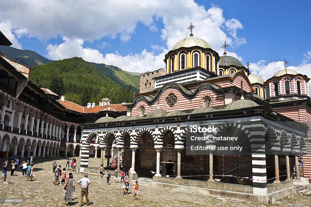 Rila Monastery "Rila Monastery, Bulgaria - August 19, 2009: The Eastern Orthodox church on the Rila Monastery grounds, the largest in Bulgaria. This monastery is one of the most important cultural, architectural, and historical monuments of Bulgaria." Architectural Dome Stock Photo