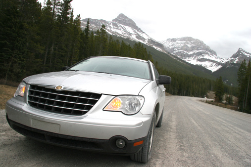 Kananaskis, Canada - May 20, 2008: The Chrysler Pacifica SUV on a rugged road in the Canadian Rockies.