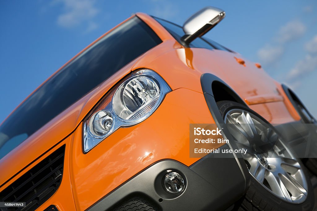 Volkswagen Cross Polo, small SUV-styled car against blue sky Ulm, Germany - March, 25th 2007: A brand new small SUV-styled Volkswagen Cross Polo at a car dealership, angled front side view against blue sky Alloy Wheel Stock Photo