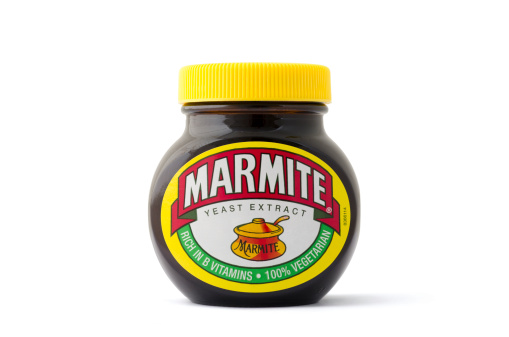 Weston-s-Mare, United Kingdom - February 26, 2011: An isolated 250g jar of Marmite yeast extract spread. Marmite is a trademark of Unilever.