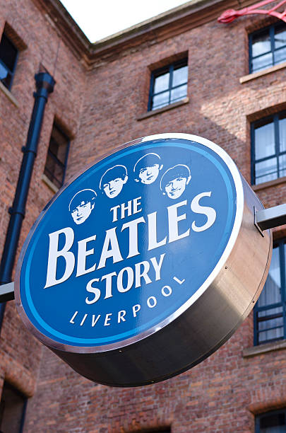 The Beatles Story, museum sign, Liverpool Liverpool, United Kingdom - June 19, 2011: The Beatles Story, museum sign, Liverpool. Sign above the entrance to The Beatles Story museum in Liverpool situated in Albert Dock. The Beatles Story is a visitor attraction that explores the music, life, times and culture of the 1960s group The Beatles who originated from the city. beatles stock pictures, royalty-free photos & images