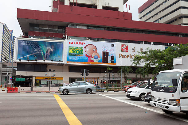 People's Park Complex Singapore City, Singapore - May 14, 2010 : Pedestrians and traffics at the Eu Tong Sen Street, Chinatown, Singapore. People\'s Park Complex, it is the famous shopping mall and residential building in Chinatown. sharp corporation stock pictures, royalty-free photos & images