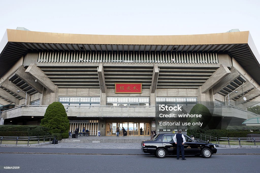 Nippon Budokan in Japan Tokyo, Japan - November 25, 2011: People in front of the entrance of Nippon Budokan. It is located in 2-3 Kitanomarukoen, Chiyoda, Tokyo, Japan. It was built for the 1964 Summer Olympics. It is a famous venue for musical events. Nippon Budokan Stock Photo