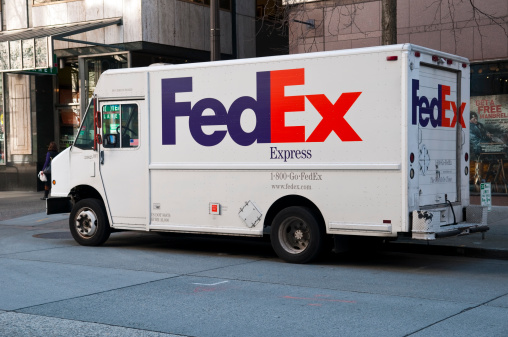 Seattle, Washington, USA - March 23, 2012: A Federal Express delivery truck parked on a city street in downtown Seattle.