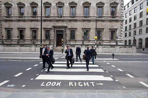 Englishmen "London, UK - July 26, 2011: English office workers cross the street on Pall Mall July 26, 2011 in London, UK" civil servant stock pictures, royalty-free photos & images