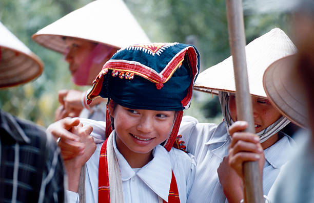 Son La, Vietnam - September 9, 2000: Smiling vietnamese working girl along the road to Son La, Vietnam. Outdoors, selective focus.