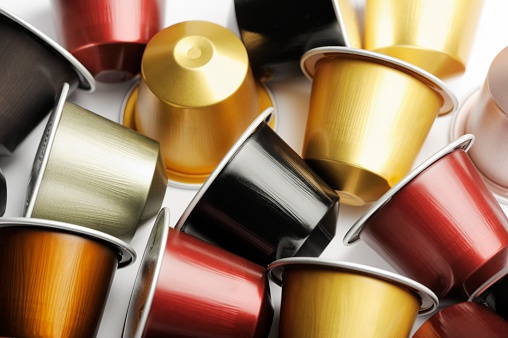 Antibes, France - January 31, 2012: A selection of aluminium Nespresso Coffee Capsules. Nespresso, a brand owned by the Swiss Nestle Group, is an espresso coffee making system employing special machines that take a single-dose coffee capsule; the colour of the capsule donates a specific type and flavour of ground coffee.