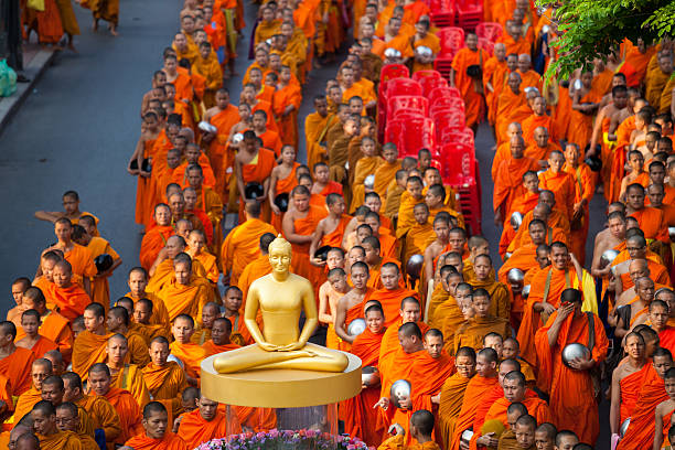 Bangkok, Thailand - March 17, 2012: Monks are participating in a Mass Alms Giving in Saphan Khwai for the Makha Bucha celebrations in Bangkok, Thailand