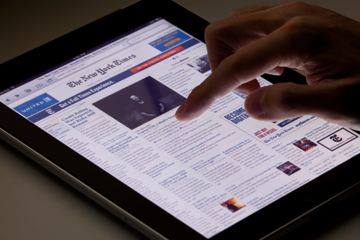 Hong Kong, China - August 7, 2011: Image of browsing the New York Times website using an ipad. The New York Times is a popular American daily newspaper founded in New York City since 1851. Its website is the most popular American online newspaper website.