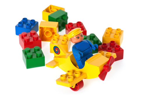 Albuquerque, USA - December 5, 2011: Duplo bricks are twice the length, height and width of traditional Lego bricks (eight times the size in volume), as a result being easier to handle &amp;ndash; as well as being far harder to swallow &amp;ndash; by younger children. Despite their size, they are still compatible with traditional Lego bricks. Initially launched in 1969, the Duplo range has gone on to include sets with figures, cars, houses and trains. These Duplo elements are from 1988.