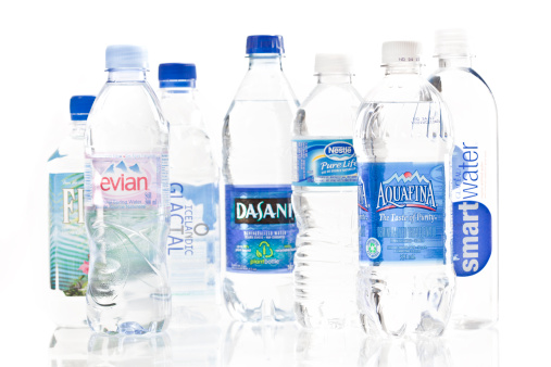 Calgary, Alberta, Canada - March 26, 2011. Product shot of a various bottled water brands. Global bottled water sales have increased dramatically over the past several decades, reaching a valuation of around $60 billion and a volume of more than 115 million litres in 2006.