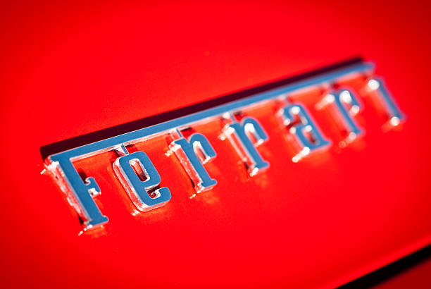Ferrari Logo Macro on Red Background with Selective Focus stock photo