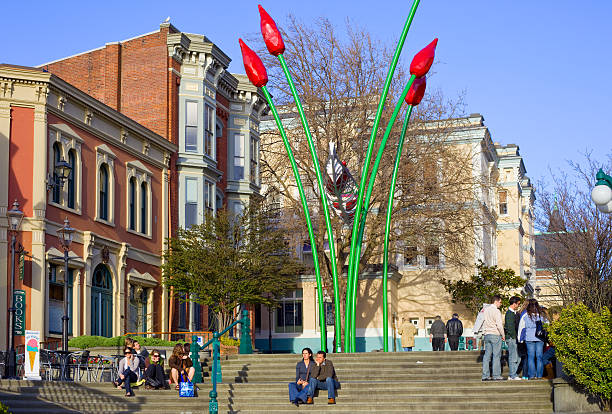 Victoria, Canada - April 19, 2009: People enjoying a sunny spring day at downtown Victoria's Bastion Square.