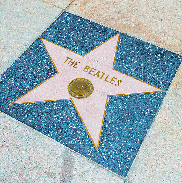 Beatles Los Angeles, USA - June 24, 2011: The Beatles star on the Hollywood Walk of Fame which is Located on Hollywood Boulevard. This is one of 2000 celebrity stars made from marble and brass. beatles stock pictures, royalty-free photos & images