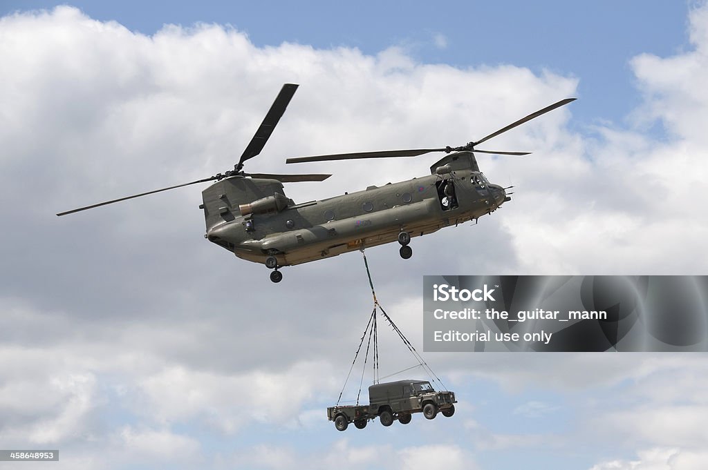 chinook helicopter "Farnborough, United Kingdom - July 24, 2010: British military Chinook transport helicopter giving a cargo carrying demonstration at the Farnborough International Airshow, 2010." Boeing CH-47 Chinook Stock Photo