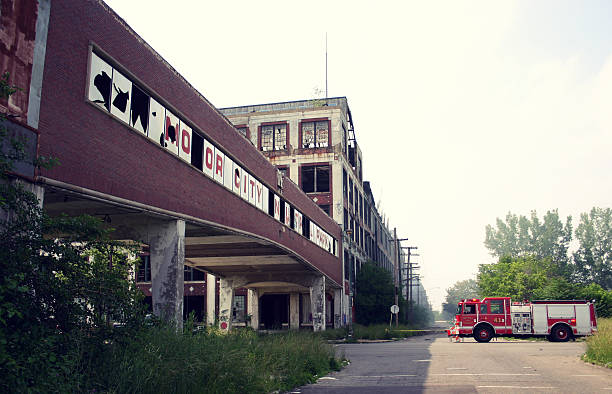 Detroit Fire Department at the Abandoned Packard Plant Detroit, Michigan - June 12, 2010: The Detroit Fire Department responds to an arson fire at the Packard Plant. This abandoned automobile manufacturing plant has been deteriorating since closing its doors in 1957 and is often the target of vandalism. detroit ruins stock pictures, royalty-free photos & images