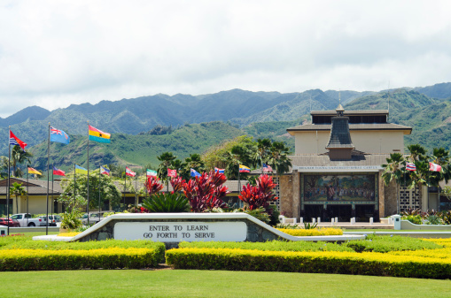 Laie, United States - April 19, 2011: Main entrance to the Brigham Young University - Hawaii campus with sign greeting visitors stating \\\