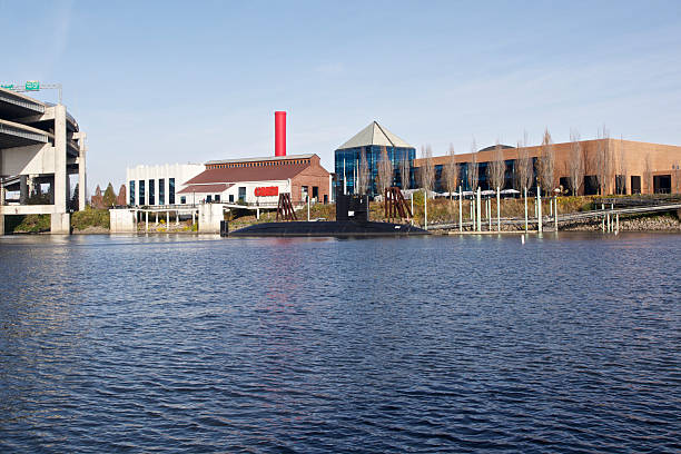Portland, USA - November 20, 2011: OMSI ( The Oregon Museum of Science and Industry ) in Portland, Oregon. The Buildings, East side of the Willamette River, elevated road and the submarine USS Blueback are shown.