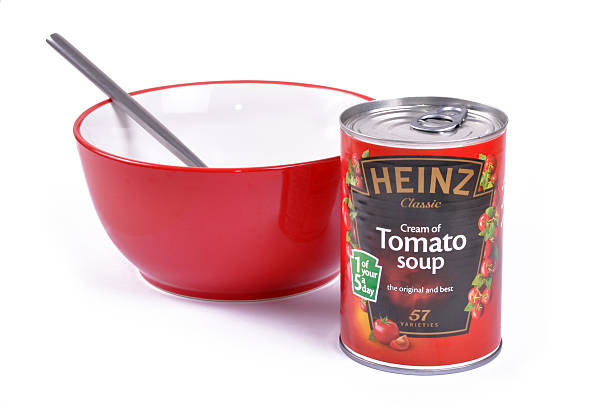 Heinz Soup and Bowl Bournemoith, UK - November 20, 2011: Heinz Cream of Tomato soup in a tin can and a bowl. Heinz Tomato Soup stock pictures, royalty-free photos & images