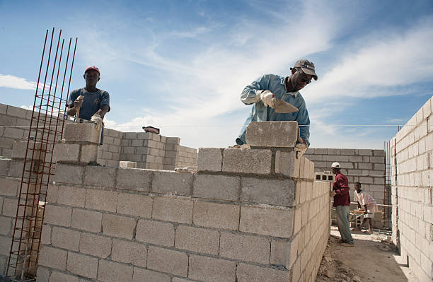 Bricklayers building a new house stock photo