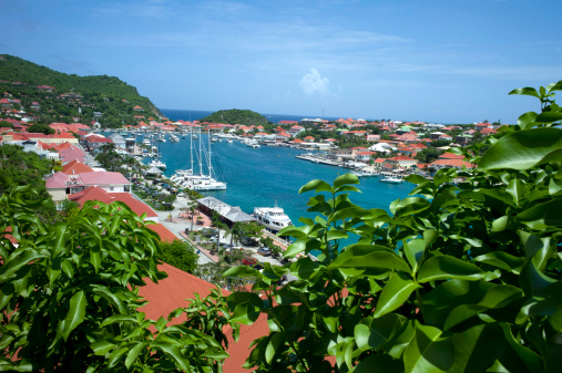 Gustavia, St. Barts, France - June 10, 2011: Gustavia Harbor with both sail boats and yachts moored on a perfect blue sky day