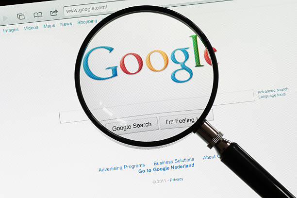 Google "Utrecht, The Netherlands - June 12, 2011: A magnifying glass on the Google homepage. Google is the most popular web search engine." google brand name photos stock pictures, royalty-free photos & images