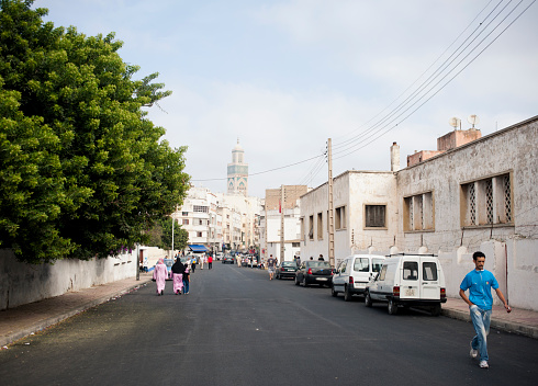 Casablanca, Morocco - October 3, 2011: The walkway goes to Hassan II mosque in Casablanca Downtown near the avenue De Bordeaux. Mosque visible at the end of the street.