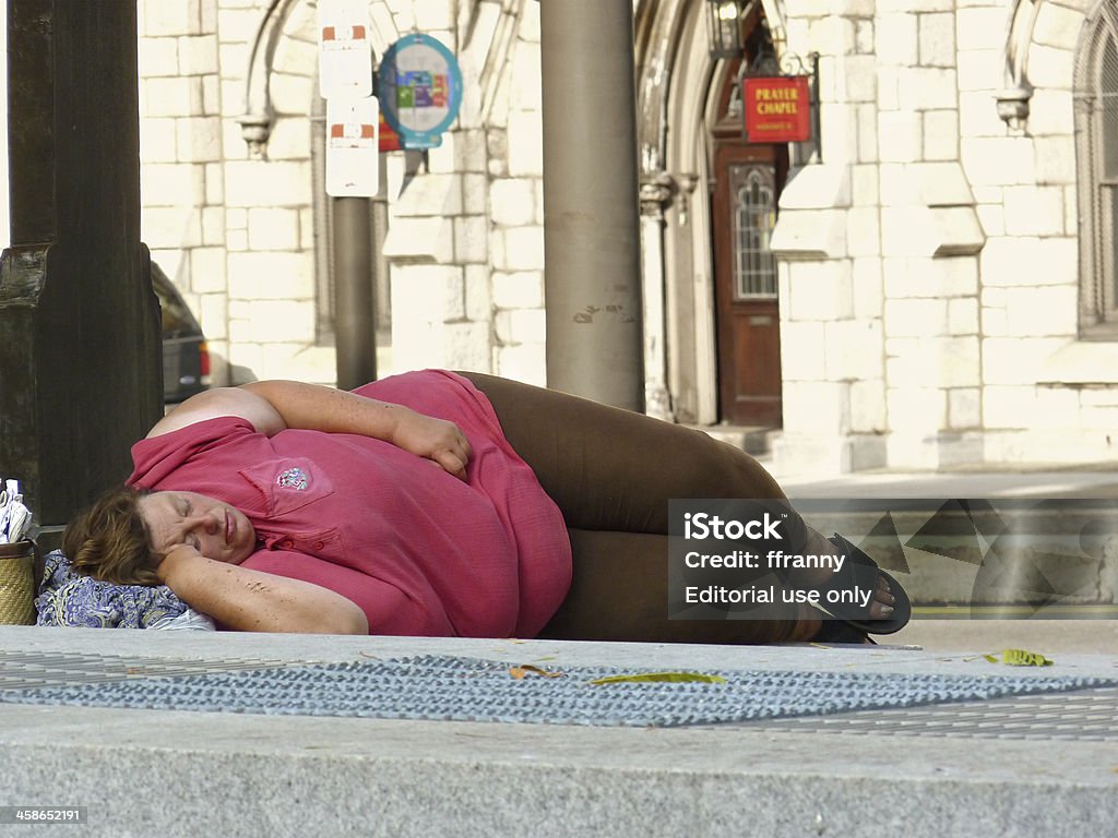 Homeless woman sleeping on sidewalk "Philadelphia, Pennsylvania, USA - September 5, 2011: Unidentified overweight woman sleeps on a sidewalk in Philadelphia on September 5, 2011." Fernando Botero Stock Photo