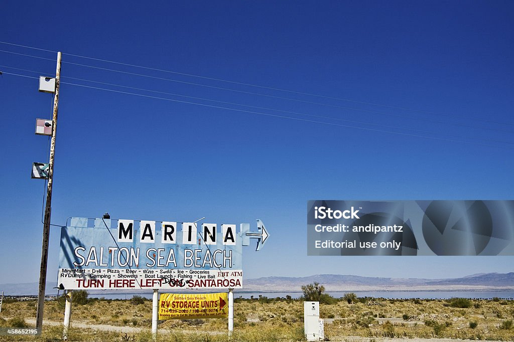 Salton Sea Beach Marina Salton Sea Beach, California, USA - March 23, 2008: An old dilapidated sign advertising the Salton Sea Beach Marina stands  alongside the road from days past when the Salton Sea was a thriving tourist attraction. Salton Sea Stock Photo