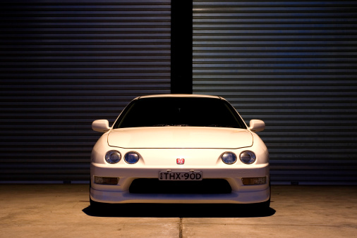 Sydney, Australia - June, 12th 2006: A Honda Integra Type R parked in front of a warehouse garage door.The year production for this car is from 1996 to 2001.