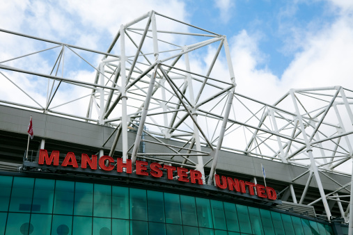 Manchester, UK - February 26, 2011: Old Trafford football stadium, the famous home of Manchester United, one of the most recognised global brands in sport.